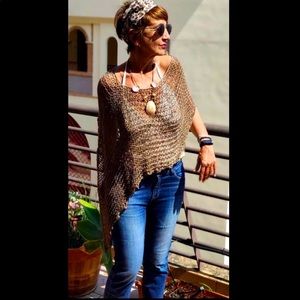 Hand-knit overhead wrap poncho.